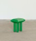 Green four tube-legged stool with a pillow shaped top/seat