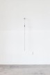 Wall mounted steel rod with a figure-eight tied knot on it. Front full view